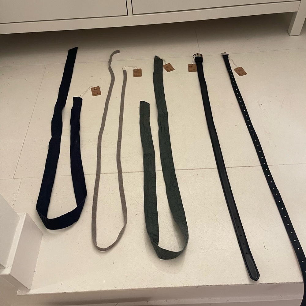 Two black belts and 3 sashes
